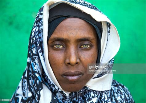 Portrait Of An Afar Tribe Woman With Green Eyes And Tattoos On Her