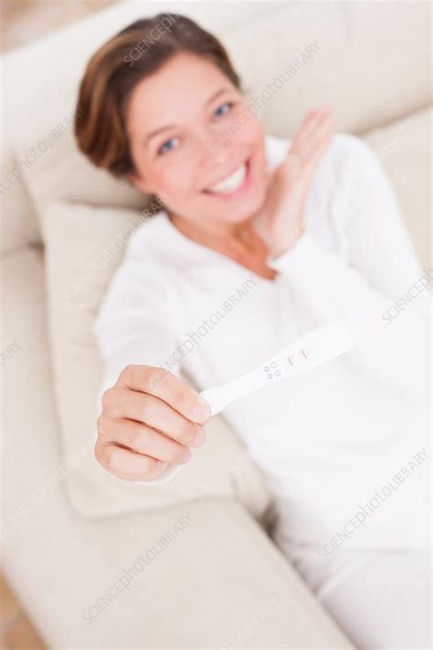 Woman Holding Positive Pregnancy Test Stock Image F018