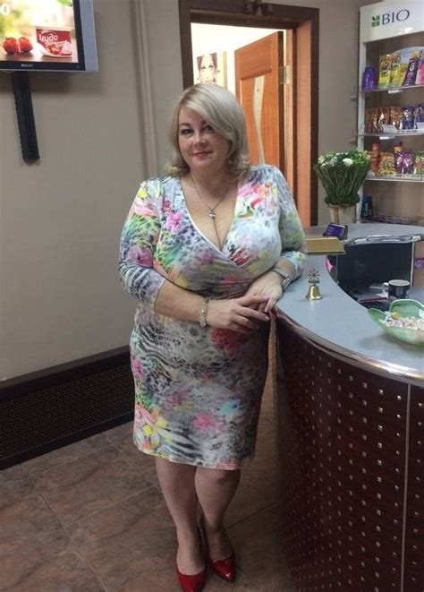 A Woman Standing In Front Of A Counter