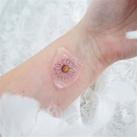 Watercolor Daisy Tattoo On The Wrist