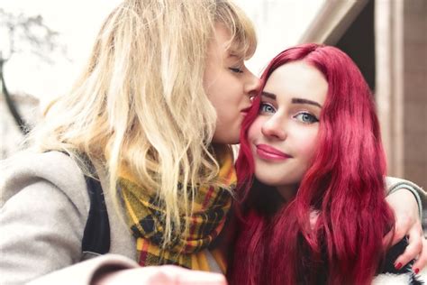 premium photo blonde lesbian kissing forehead of her loving