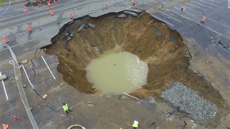 bus washes away after collapsing in sinkhole cnn video