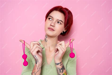 Free Photo Medium Shot Woman Holding Pink Sex Toys