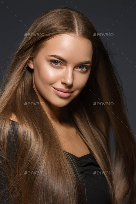 Brunette Woman With Long Hair Natural Tanned Skin Dark Background