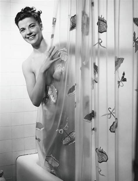 Woman Peering Through Shower Curtain Photograph By George