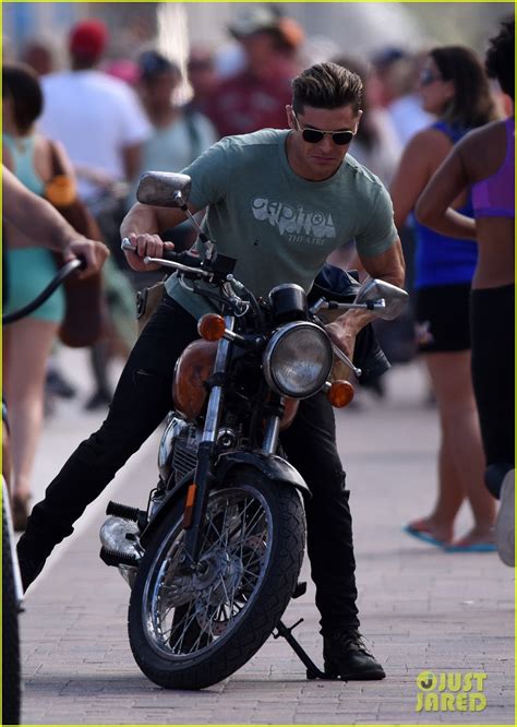 Zac Efron Shows His Muscles On A Motorcycle For Baywatch