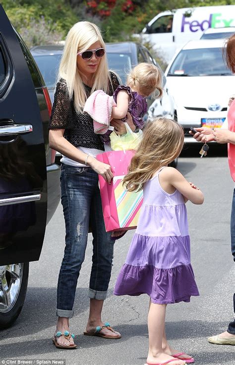 tori spelling puts on brave face as she takes daughters to birthday
