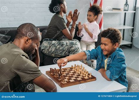 father army uniform kissing african american daughter royalty