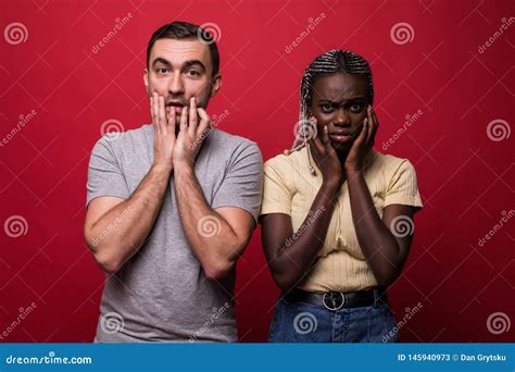 portrait of shocked interracial couple african woman and caucasian man
