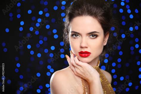 beautiful brunette woman model with red lips in elegant style stock