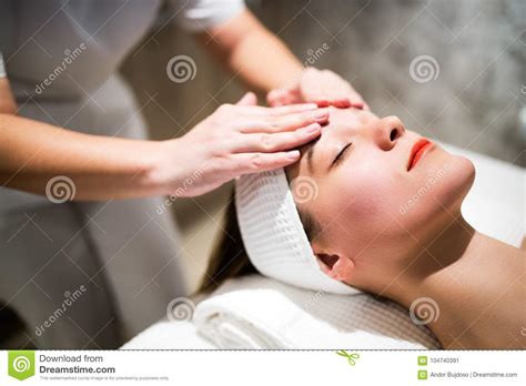 rejuvenating relaxing massage  masseur stock image image  face