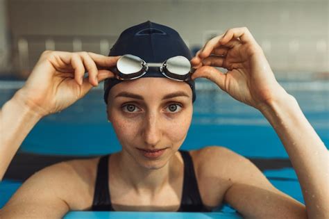 Premium Photo Portrait Of Professional Female Swimmer In Cap