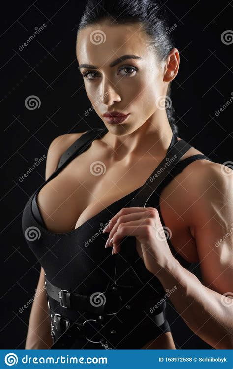 brunette with big breast posing looking at camera stock