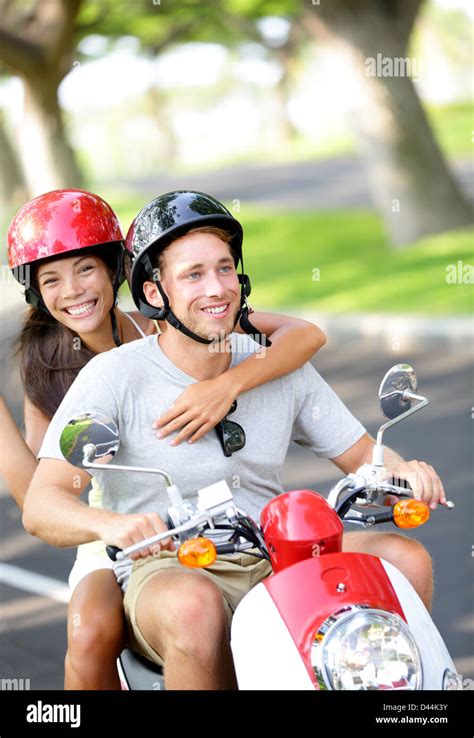 Happy Interracial Couple Asian Woman Caucasian Man Wearing Helmets In