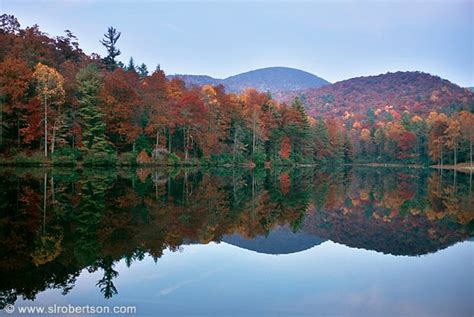photo  fall color reflecting   water  lake winfield scott north georgia mountains