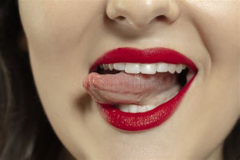 Smiling Girl Opening Her Mouth With Red Lips And Showing The Long Big