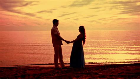 couple beach sunset couple silhouette stock footage video