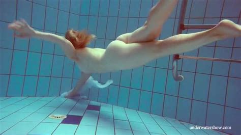 redhead goes for a nude swim in the pool alpha porno