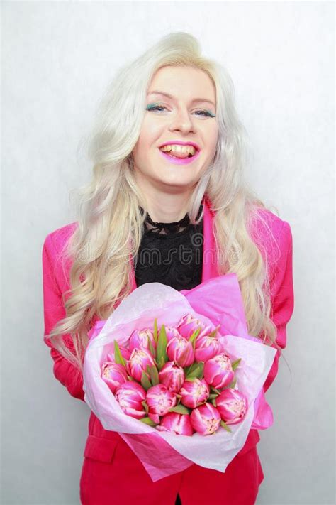 tender pretty blonde slim teen girl with pink flowers cheerful woman