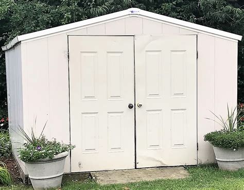 royal outdoor products    composite shed  double doors  contents disassembled  ski