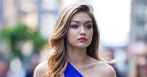 gigi hadid shows off impressive six pack in tiny blue crop top for sex and the city style