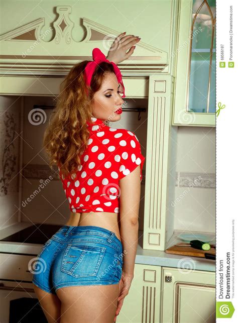 Portrait Of Sexual Woman In Pinup Style Posing On Kitchen Free