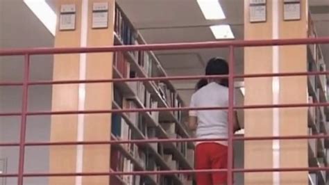 brunette asian girl seducing her coed in the library porn videos