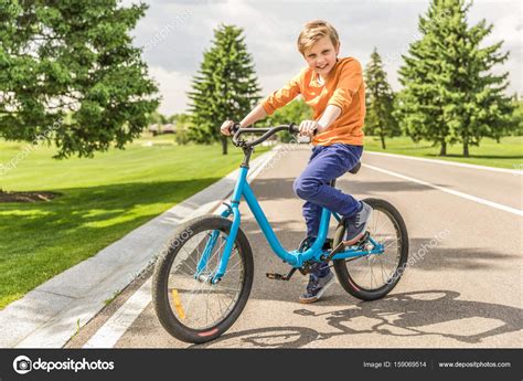 boy riding bicycle stock photo  igorvetushko