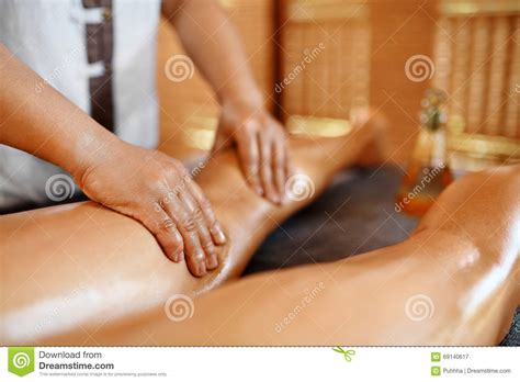 spa woman body care legs oil massage therapy skin care stock image