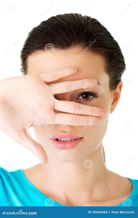 attractive woman covering  face  hand stock images image