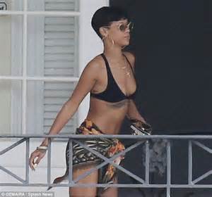 Rihanna Keeps Watch With Binoculars As She Relaxes At Barbados Villa