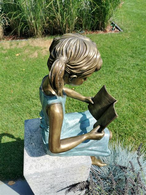 bronze garden sculpture girl reading  book bronze children