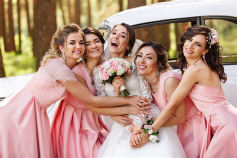 wedding photography of happy bride and bridesmaids in pink