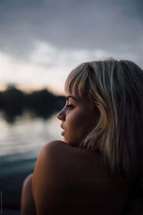 A Portrait Of A Blonde Girl On A Calm Summer Evening By Stocksy
