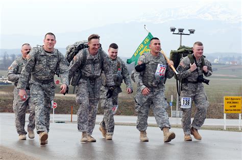 kosovo wisconsin national guard members march  memory  pows
