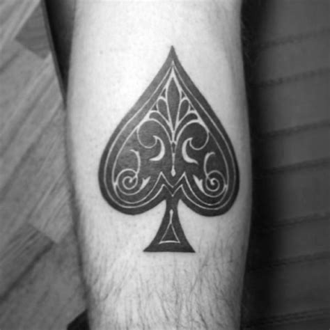 designed with fleur de lis spades symbol black ink tattoo on arm