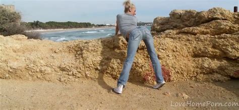 photographer owns blonde with skinny body on stony beach