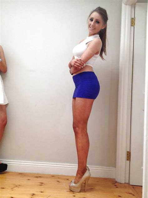 brunette in a tiny blue mini skirt and heels with legs for days dresses and skirts