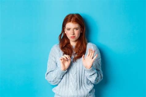 Premium Photo Reluctant Redhead Girl Asking To Stay Away Shaking