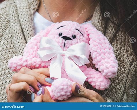 cute young woman holding  stuffed toy stock photo image  happy