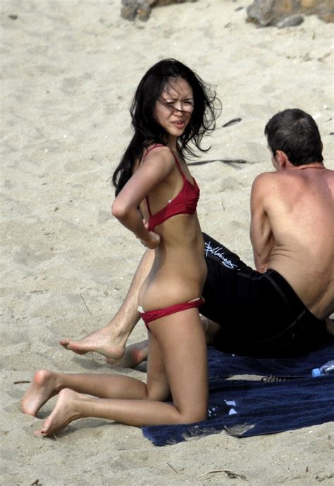 china actress 章子怡 zhang ziyi nude sunbathing at the beach