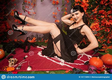slim fashion halloween girl with black hair in lace gothic