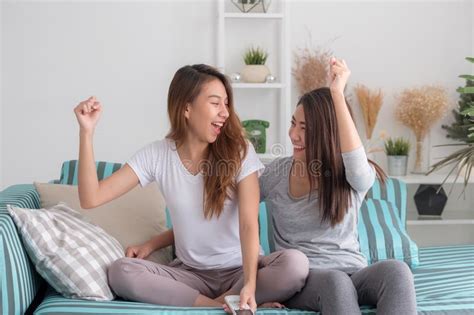 asia lesbian lgbt couple quarrel sitting each side of sofa