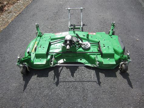 mower deck auto connect mulch kit   attaching parts  mechanical lift green