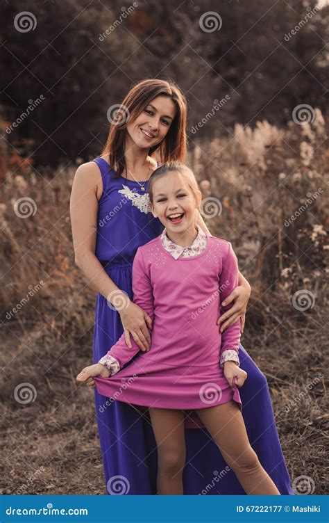 Lifestyle Capture Of Happy Mother And Preteen Daughter Having Fun