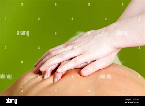 Massaging Hands Closeup Of A Massage Therapists Hands On A Woman S