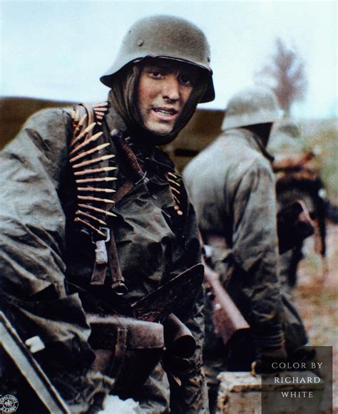 young soldier   st ss panzer division carrying ammunition