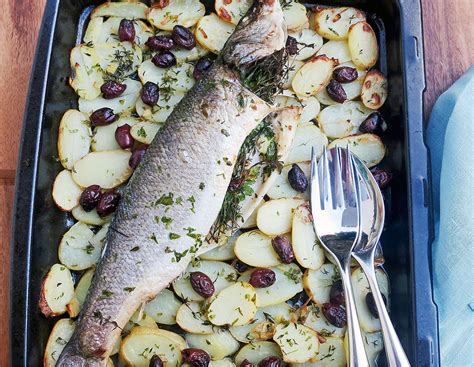 Roast Sea Bass With Potatoes Black Olives Thyme And Parsley