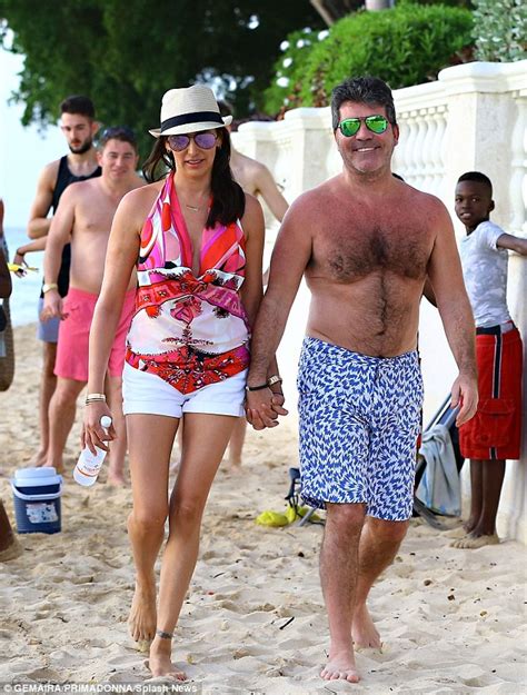 simon cowell shows off his sunburn as he heads to the beach in barbados daily mail online
