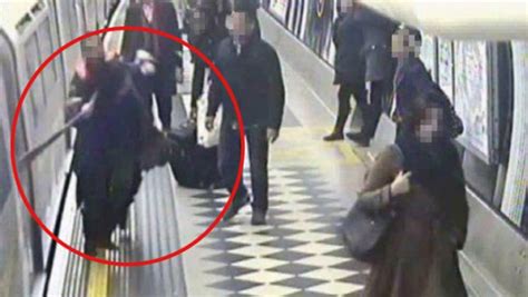 Pictured Woman Dragged Along Platform By Her Neck After Scarf Gets